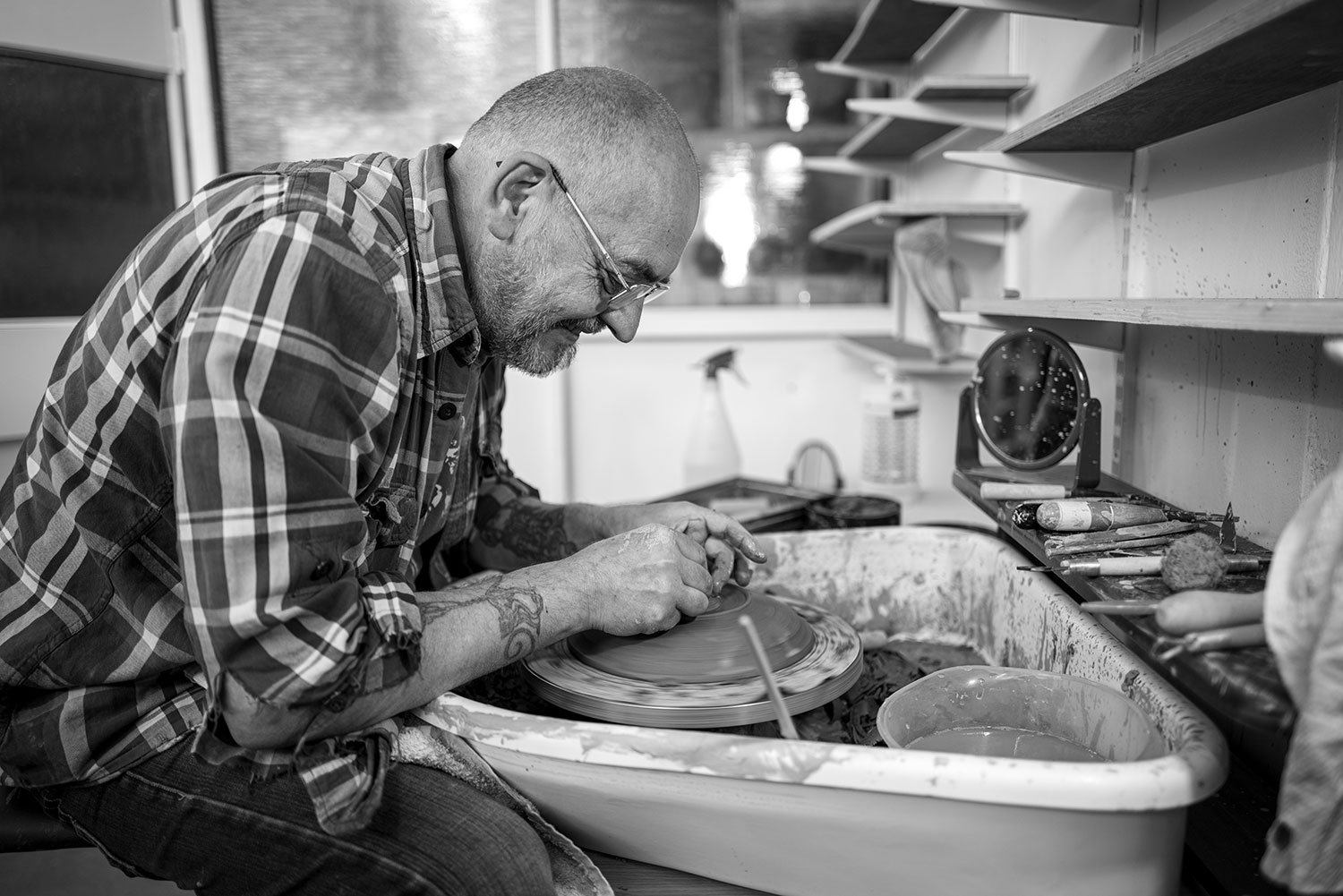 A picture of Andy using the pottery wheel